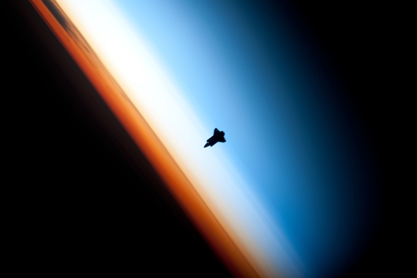 35. Orbital Sunset: Beautiful View of Earth's Colorful Horizon and the Silhouette of Space Shuttle Endeavour (STS-130), February 9, 2010 As Seen From the International Space Station (Expedition 22) While Orbiting Above the South Pacific Ocean Off the Coast of Southern Chile Latitude (LAT): -46.9 · Longitude (LON): -80.5 · Altitude (ALT): 183 Nautical Miles 