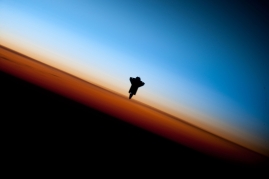 35. Orbital Sunset: Beautiful View of Earth's Colorful Horizon and the Silhouette of Space Shuttle Endeavour (STS-130), February 9, 2010 As Seen From the International Space Station (Expedition 22) While Orbiting Above the South Pacific Ocean Off the Coast of Southern Chile Latitude (LAT): -46.9 · Longitude (LON): -80.5 · Altitude (ALT): 183 Nautical Miles