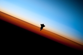 35. Orbital Sunset: Beautiful View of Earth's Colorful Horizon and the Silhouette of Space Shuttle Endeavour (STS-130), February 9, 2010 As Seen From the International Space Station (Expedition 22) While Orbiting Above the South Pacific Ocean Off the Coast of Southern Chile Latitude (LAT): -46.9 · Longitude (LON): -80.5 · Altitude (ALT): 183 Nautical Miles